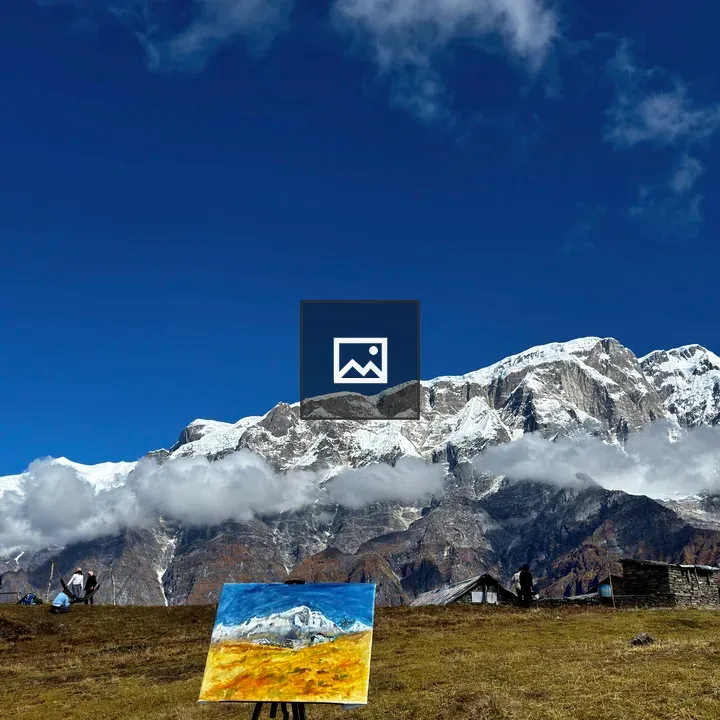 Snow-capped Mountain Painting on Easel