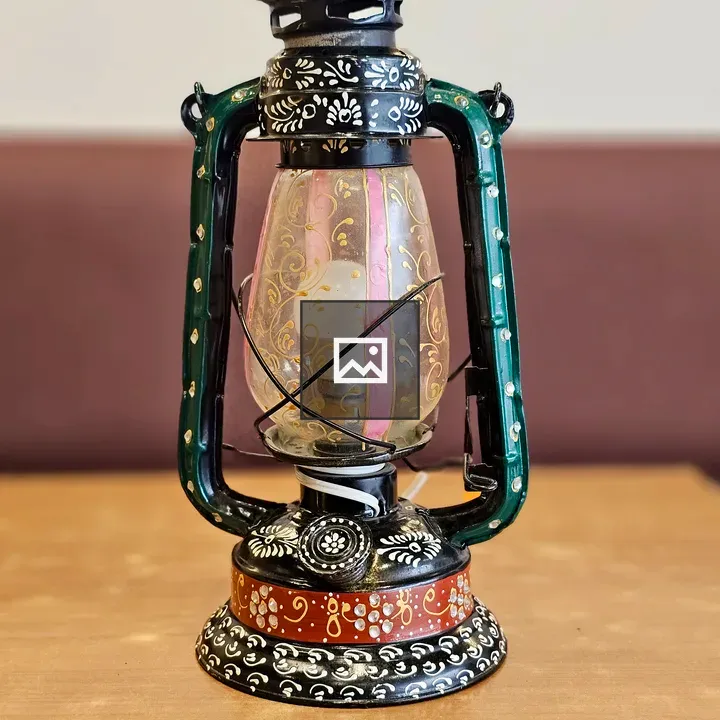 Vintage lantern on wooden surface
