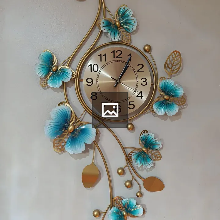 Gold wall clock with butterfly decor