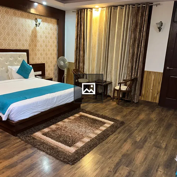 Cozy hotel room with bed and teal cushions