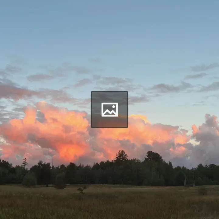 Crepuscular Light Over Green Field