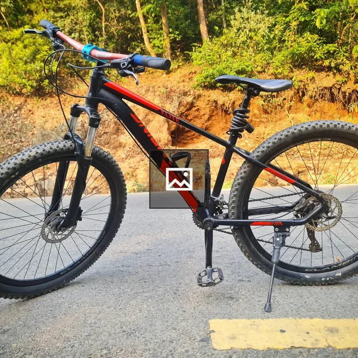 Red mountain bike by edge