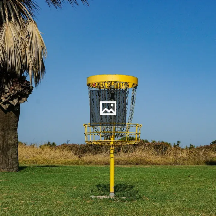 Yellow disc golf basket