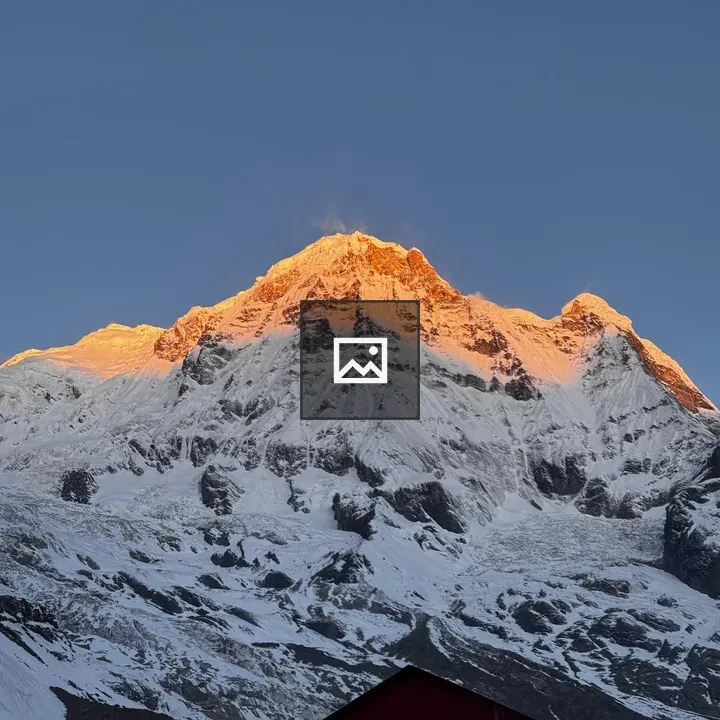 Snow-capped mountain peak sunrise