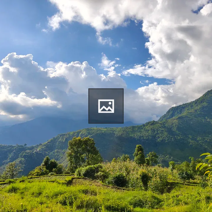 Scenic green hills under blue sky