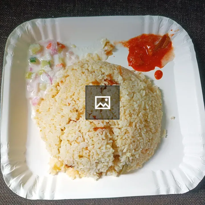 Rice with Salad and Pickle on Plate
