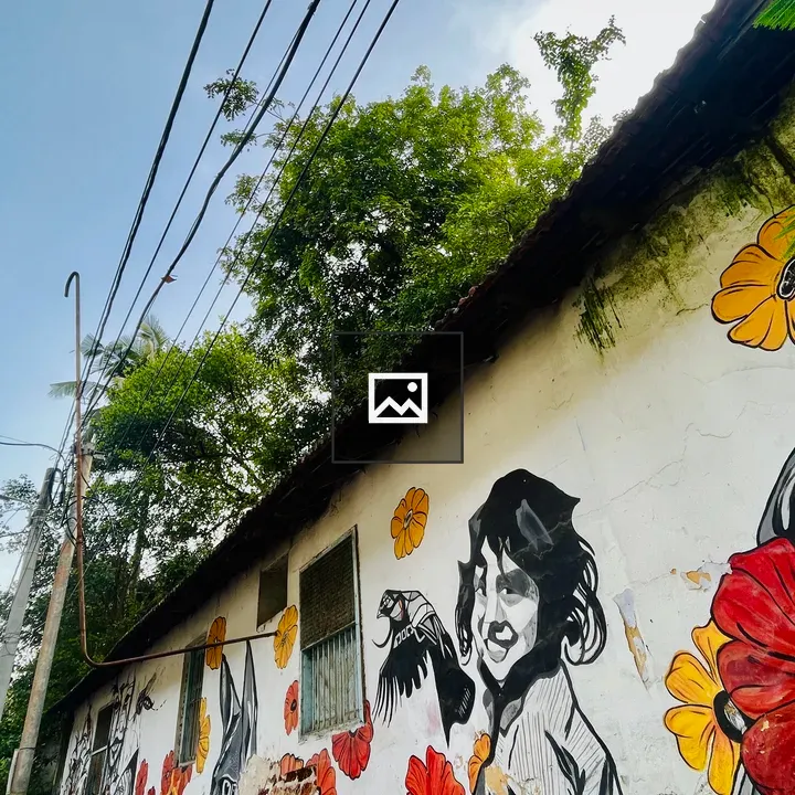 Mural of a Person, Flowers, Dog and Bird