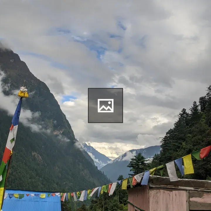 Mountain landscape with pink building