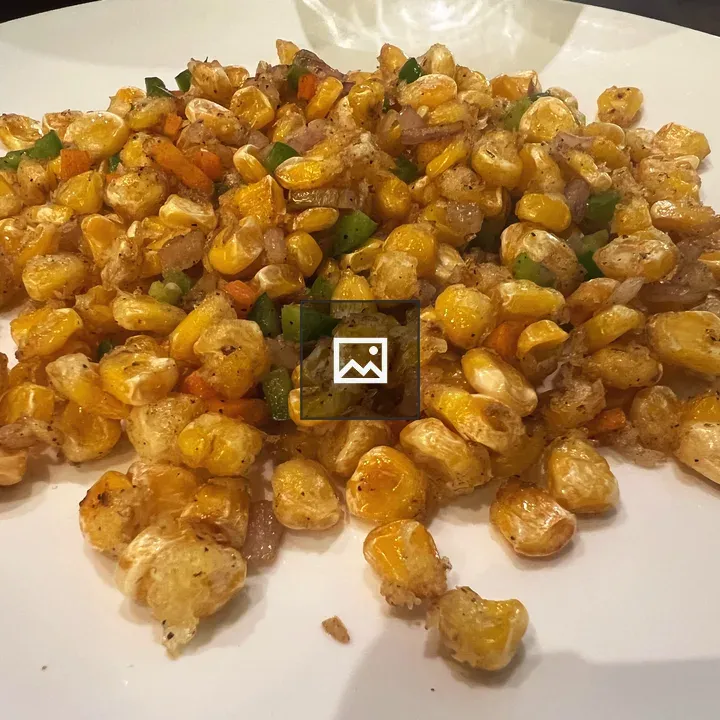 Sweet corn on white plate