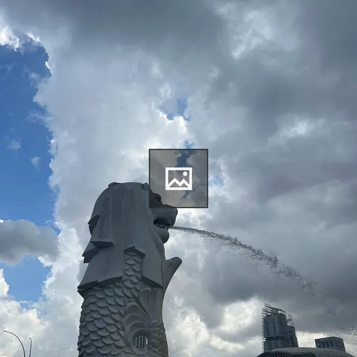 Merlion statue with dramatic sky