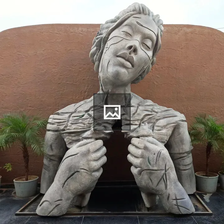 Stone sculpture of a sorrowing woman