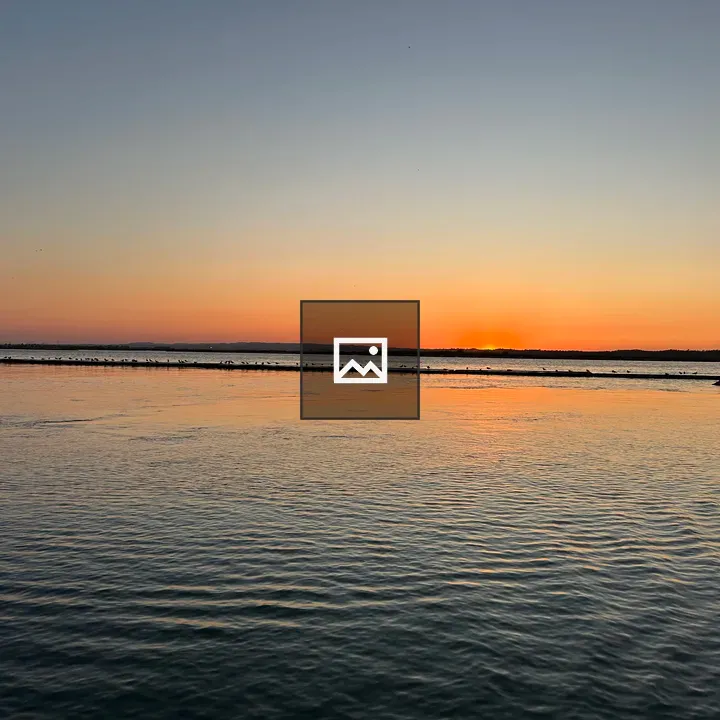 Sunset Over a Serene Water Scene