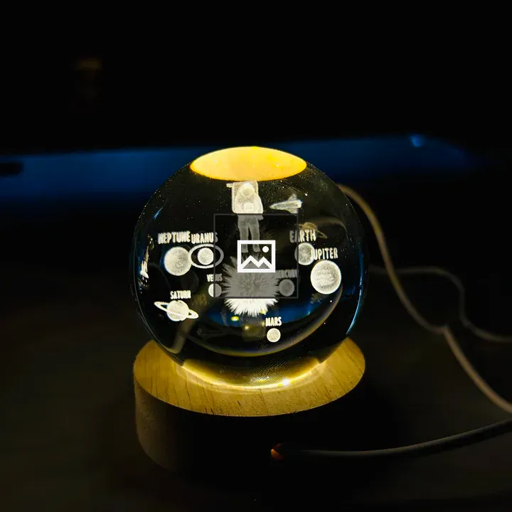 Crystal ball with astronaut engraving