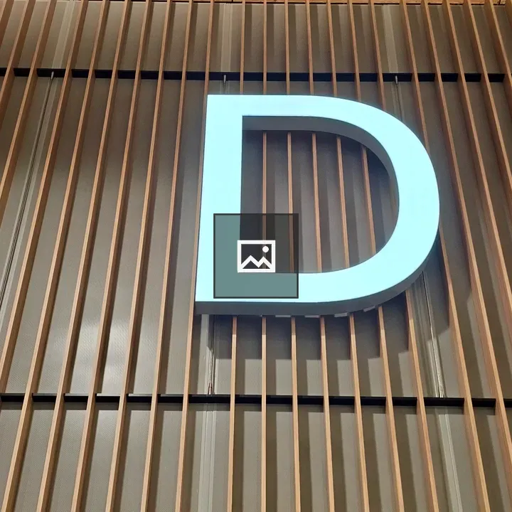 Large white letter D sign