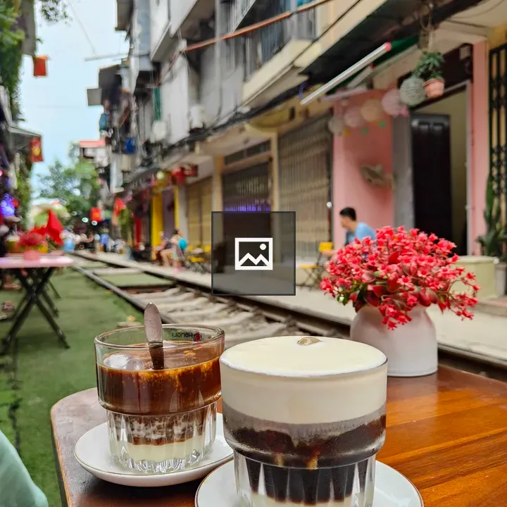 Two Vietnamese Coffees on Wooden Table
