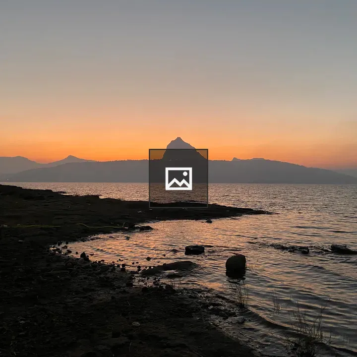 Sunset Over Water and Mountain