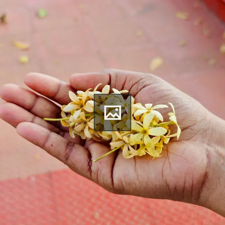 Hand with yellow flowers
