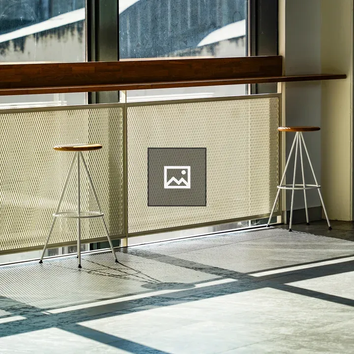 Two minimalist stools by window