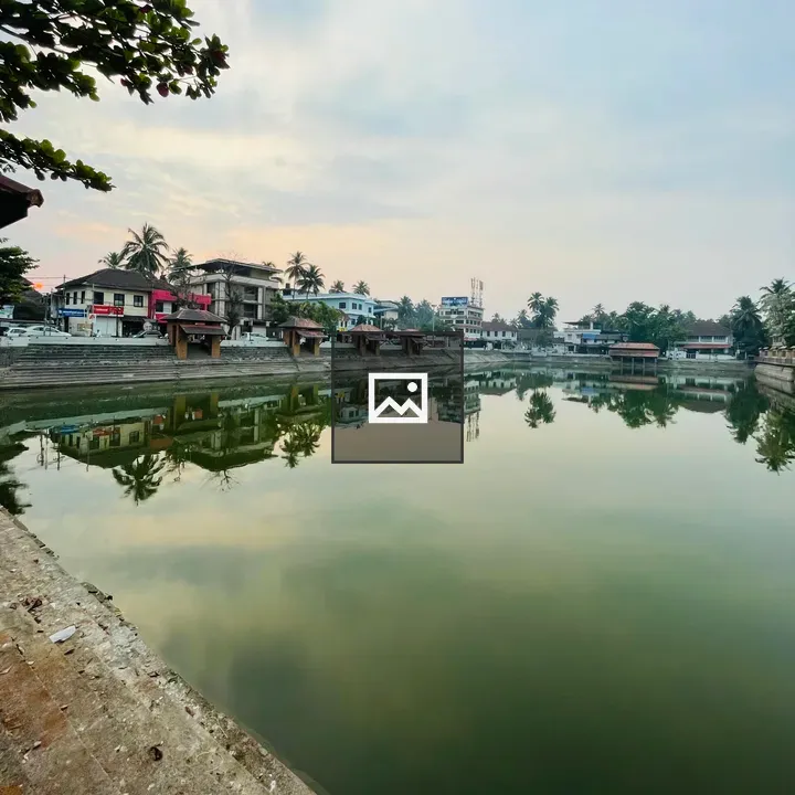 Ancient pond with city backdrop