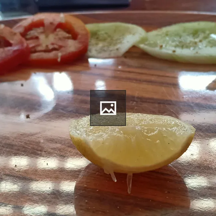 Food basket with lemon and tomato