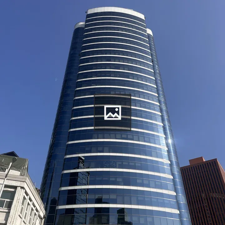 Tall skyscraper with curved glass facade