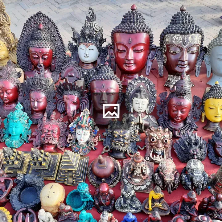 Decorative sculptures and masks on red cloth