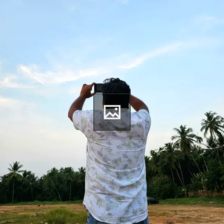 Man with Smartphone in Field