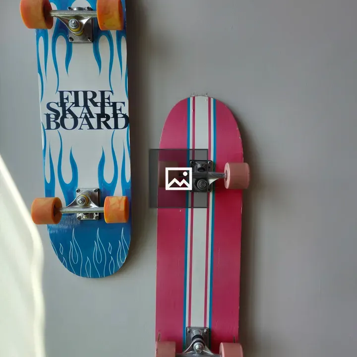 Two skateboards mounted on wall