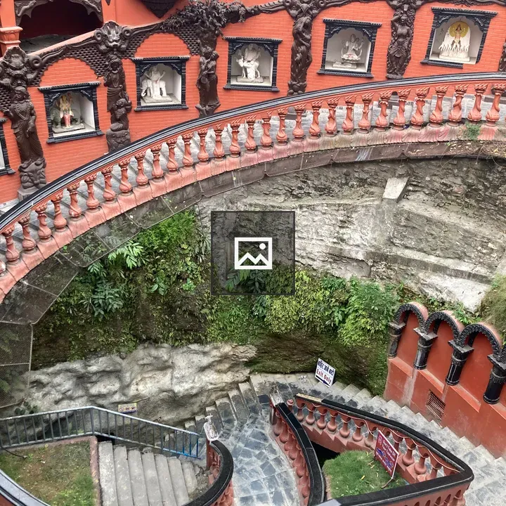 Winding staircase with ornate railings