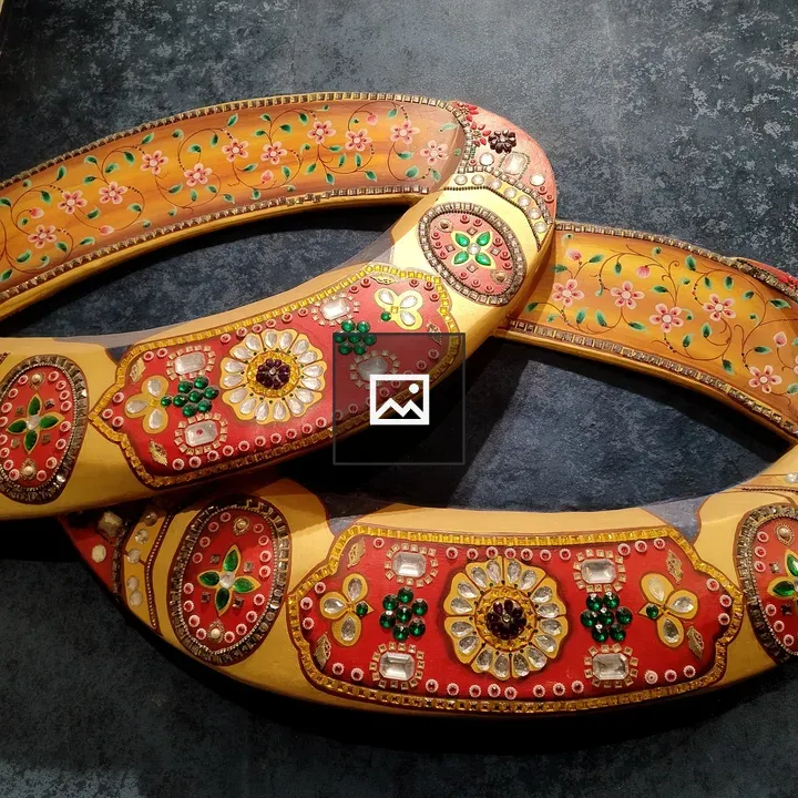 Two ornate stone yokes