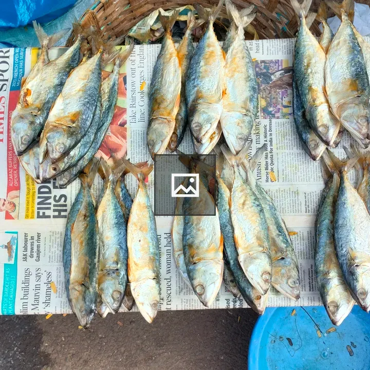 Fresh fish on a newspaper table