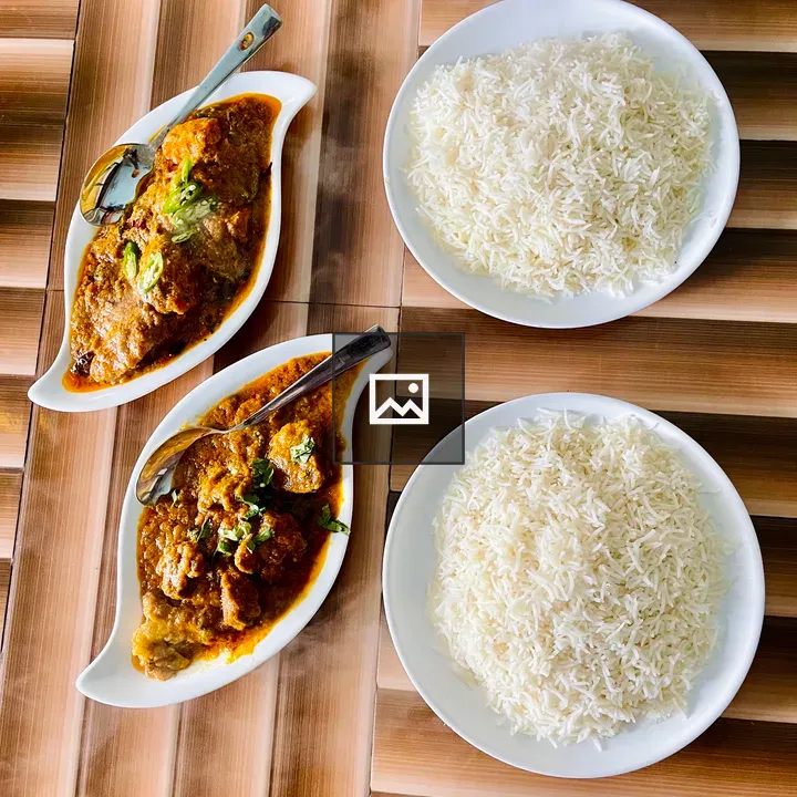 Curry and Rice on Wooden Table