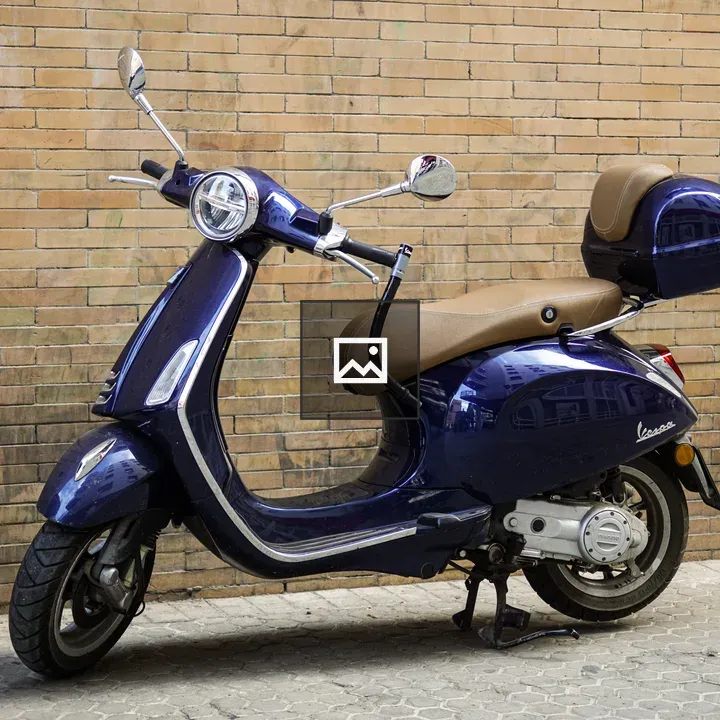 Purple Vespa Scooter on Street
