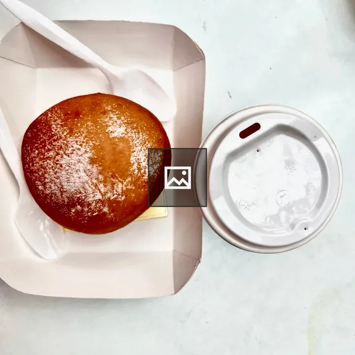 Powdered sugar donut in tray