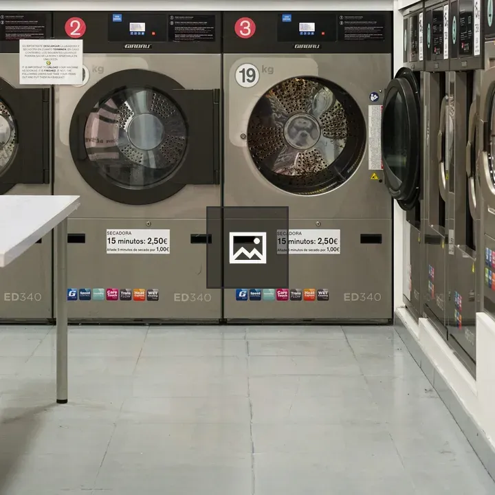 Industrial washing machines in laundromat