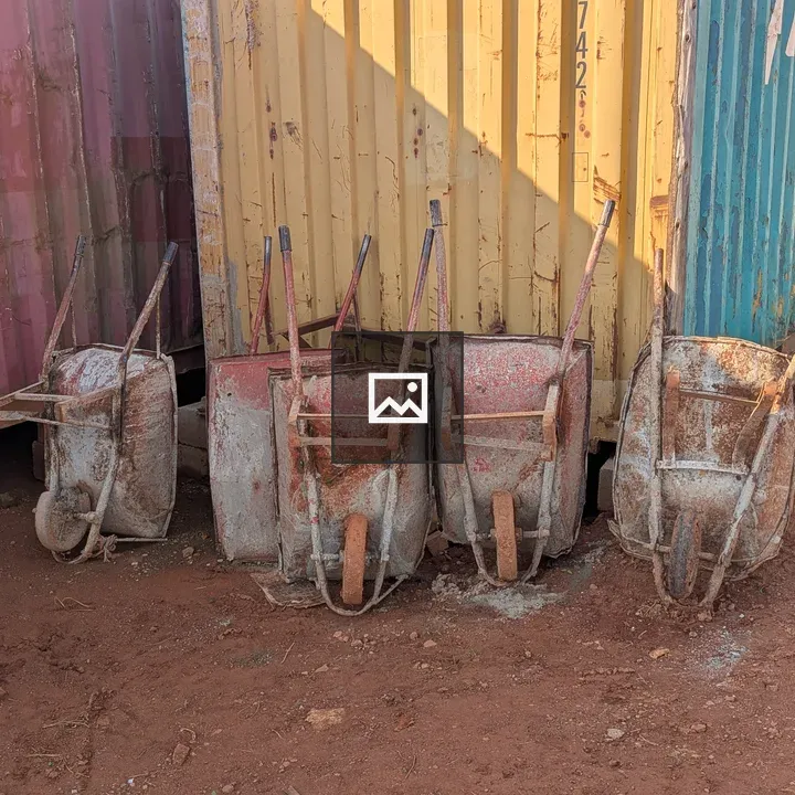 Old Wheelbarrows and Shipping Containers