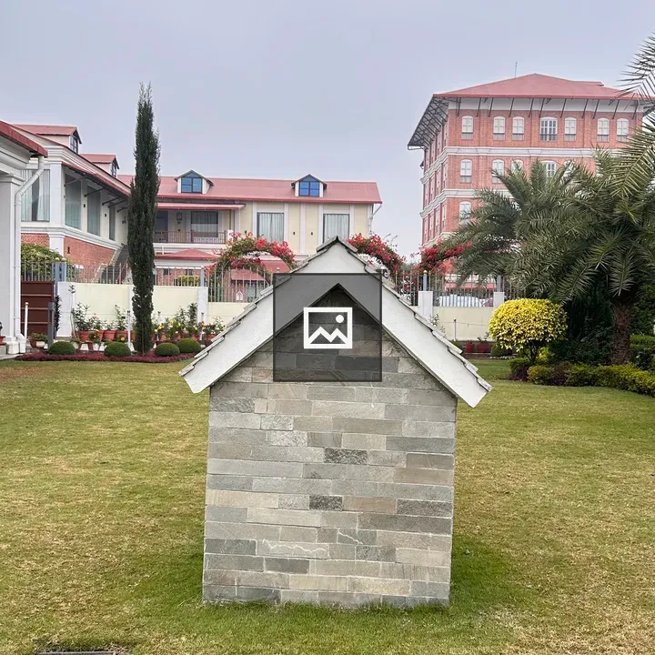 Stone house on grassy lawn