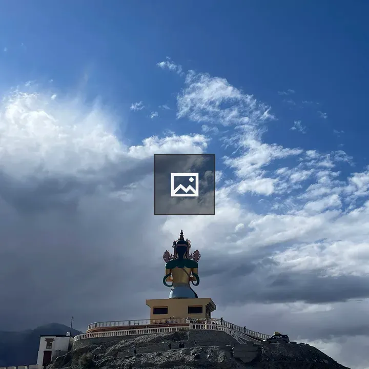 Back of Buddha statue against sky