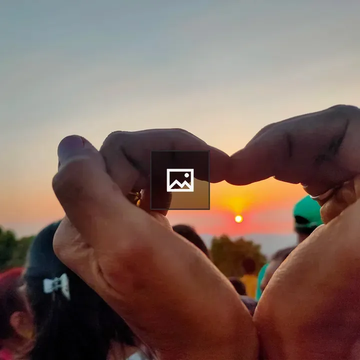 Heart-Shaped Hands Sunset