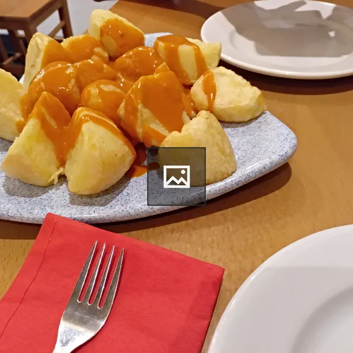 Tapas dishware and patatas bravas