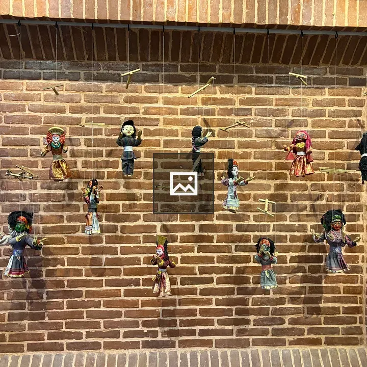 Newari dancing puppets on wall