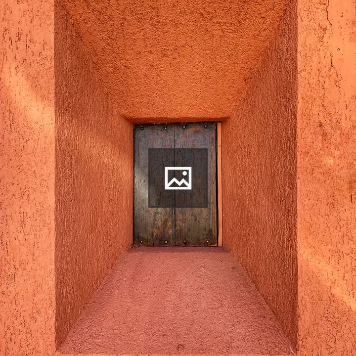 Small window on orange wall