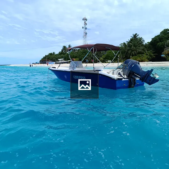 Blue motorboat on turquoise water