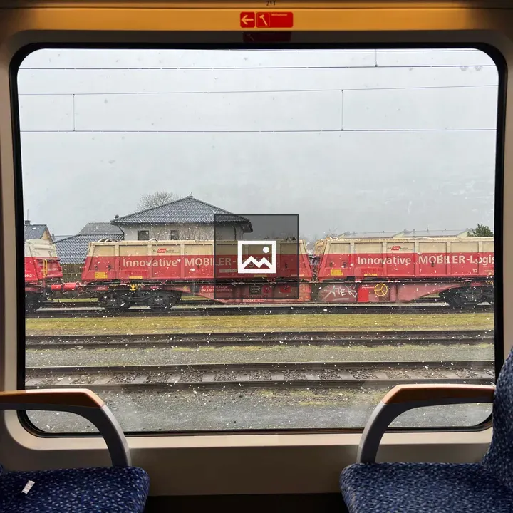 Industrial train seen through window