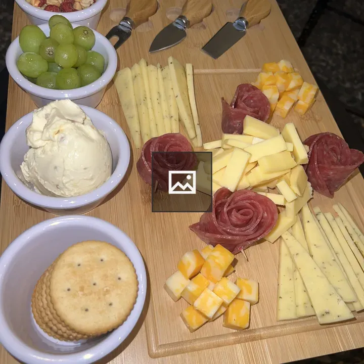Snack board with cheeses and almonds