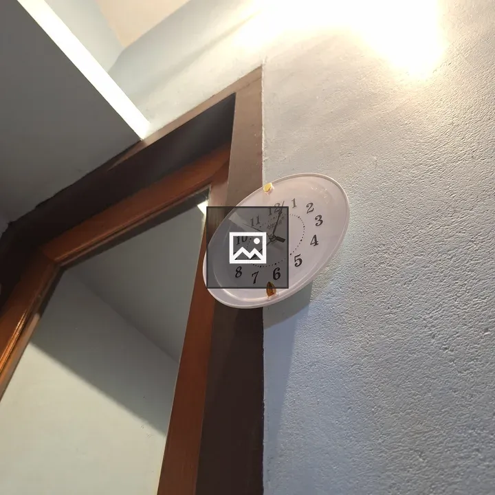 Clock on wall fixture