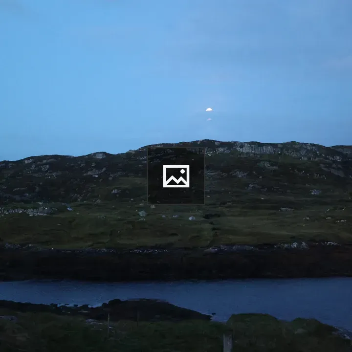 Moon over mountain and water
