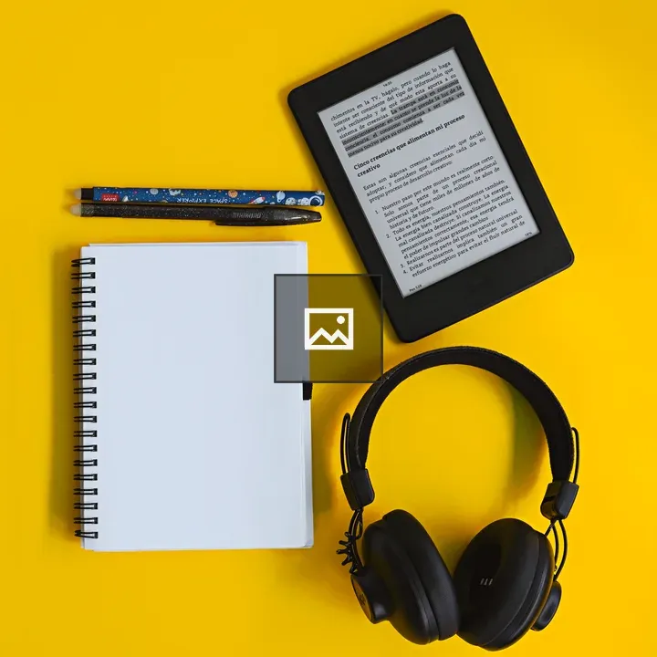 Kindle with Notebook and Headphones