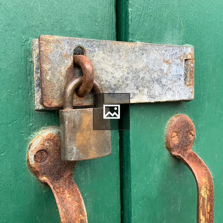 Rusty metal lock on door