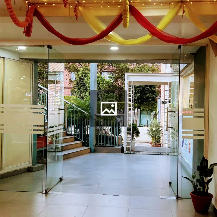 Entrance with glass doors and fabric ceiling
